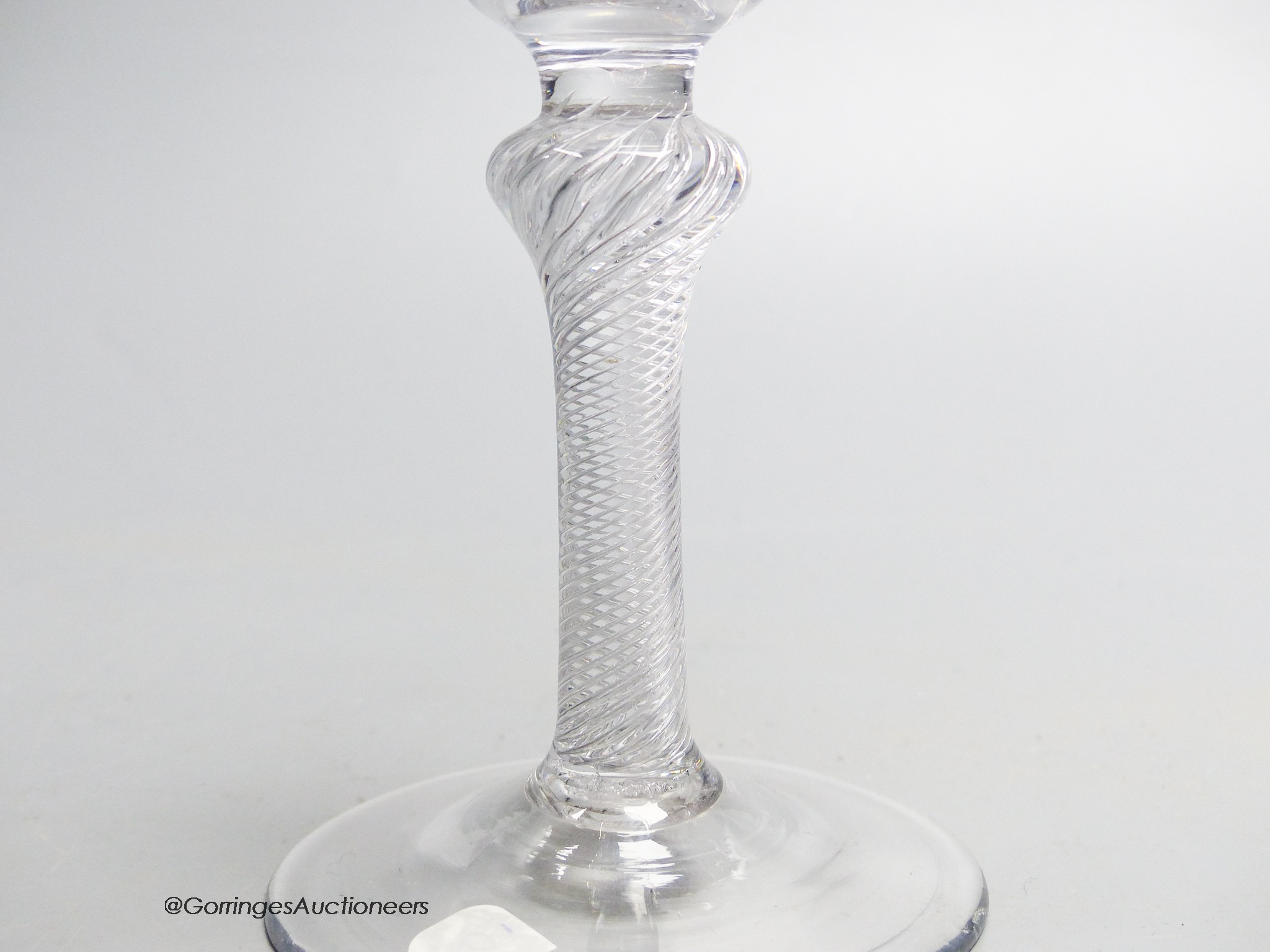 A Georgian air twist stem wine glass c.1750, a bell shaped bowl. 17cm